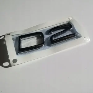 Zwrot pieniędzy VOLVO D2 emblemat na tylna klape 31333138 OE