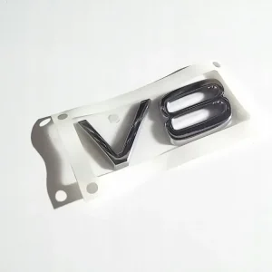 VOLVO XC90 emblemat V8 na tylna klape OE 8693955 Szybka dostawa