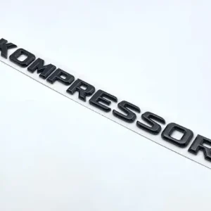 EMBLEMAT KOMPRESSOR tył znaczek MERCEDES naklejka 24,7x1,8cm CZARNY POŁYSK Tani